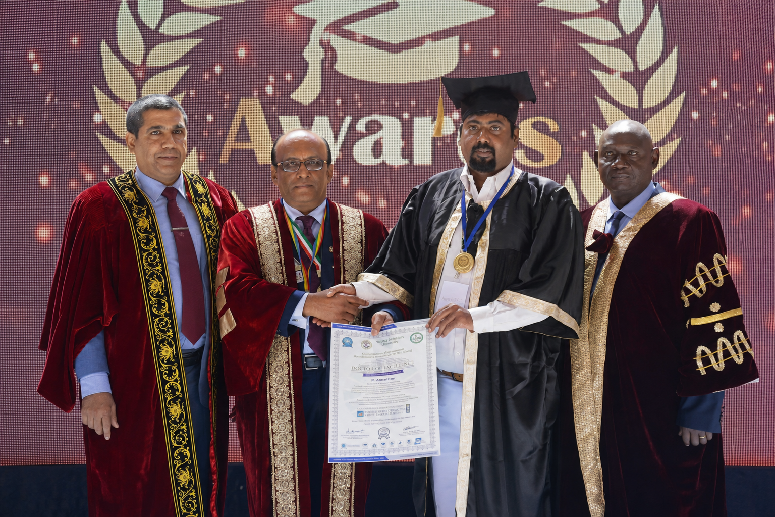 Dr. V. Amudhan receiving the Doctor of Excellence award on stage with fellow dignitaries