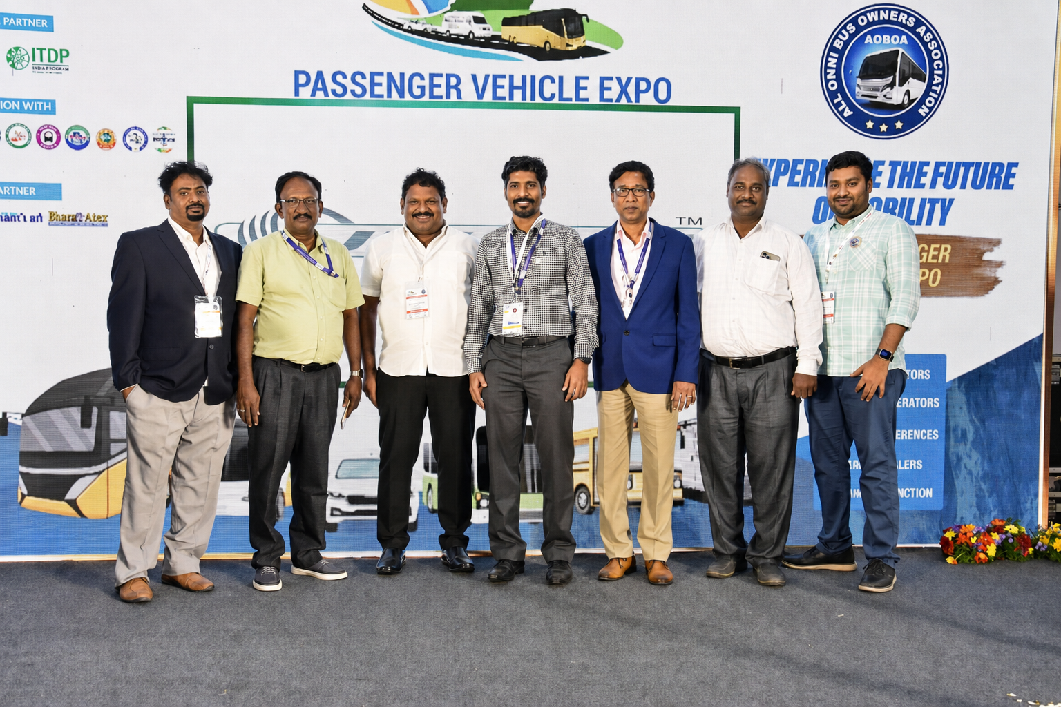 Group photo of Dr. V. Amudhan with industry partners at Passenger Vehicle Expo
