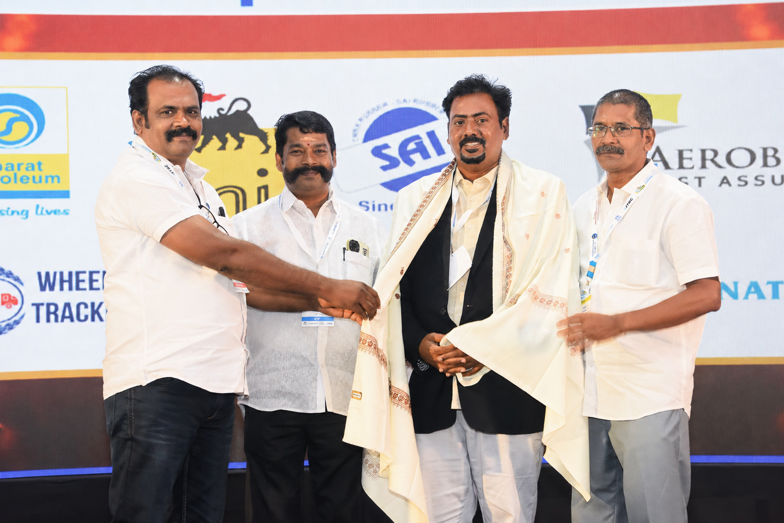 Dr. V. Amudhan being felicitated by industry partners and sponsors at an expo event